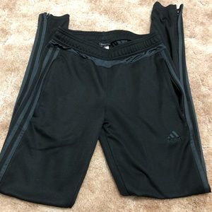 Black Adidas soccer pants with dark grey stripes
